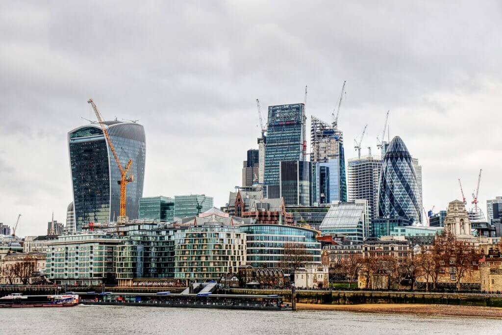 A landscape view of London featuring st. Marys Axe and 20 Fenchurch with a cloudy sky